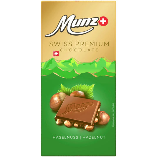 Maestrani-Munz Swiss Premium Milchschokolade mit ganzen Haselnüssen, 100g, cremige Milchschokolade mit sichtbaren Haselnüssen.